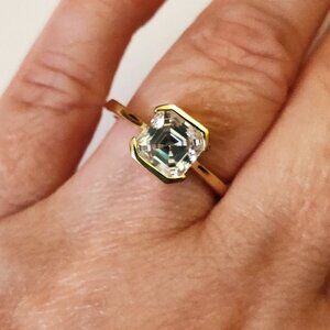 Moissanite asscher cut ring in 18k gold over sterling silver